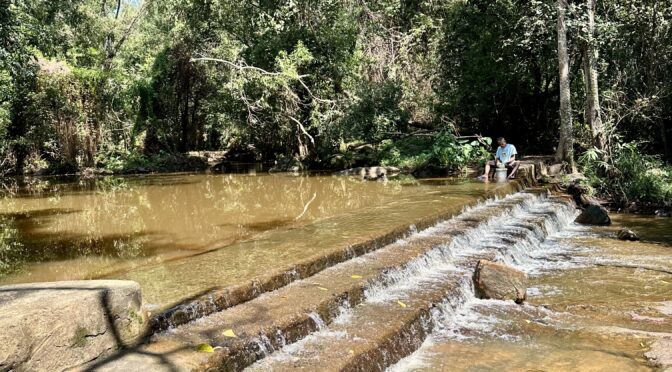 Man washing clothes at Khao I To waterfall