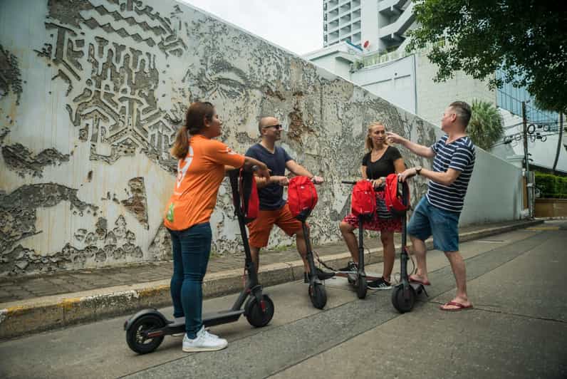 A group of Farangs with e-Scooters in Bangkok