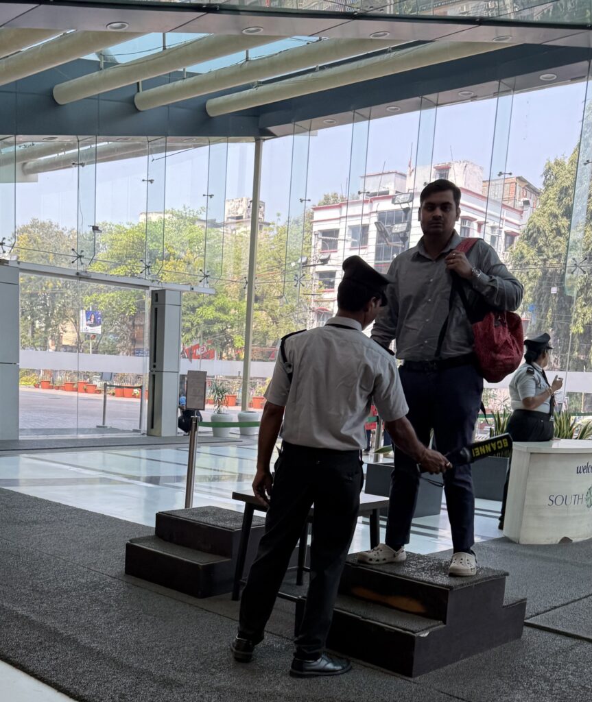 A man being frisked at South City Mall, Kolkata