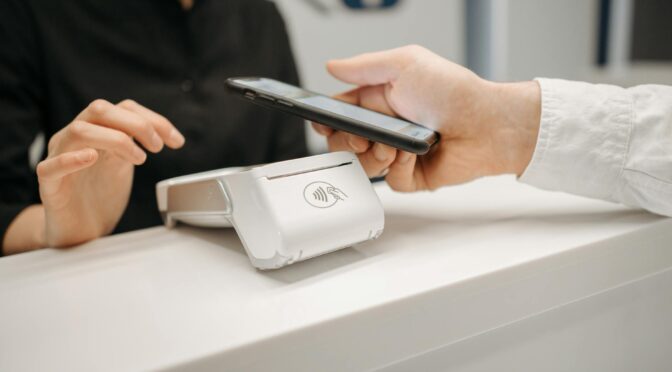 a person making payment using smartphone