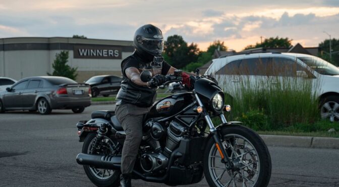 person sitting on black cruiser motorcycle